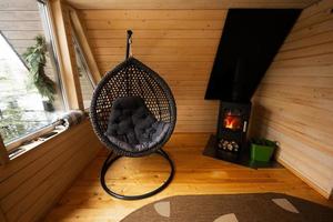 Fireplace at cozy comfortable for people cold weather easy indoors heating. Egg swing. photo
