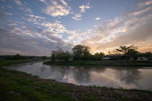 Malays village beside river in early morning photo