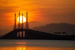 Egg yolk sunrise Penang Bridge photo