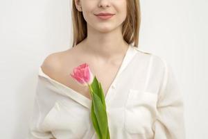 Young woman with one tulip photo