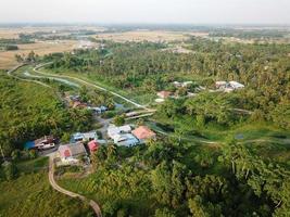 Malays village surrounded with green trees photo