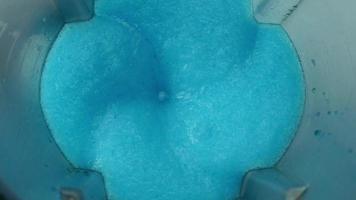 Close-up shot of blue juice in an ice blender. video