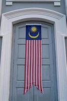 Malaysia flag banner at door photo