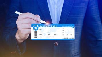 Hand holding boarding pass tickets air travel concept, Choosing checking electronic flight ticket. photo