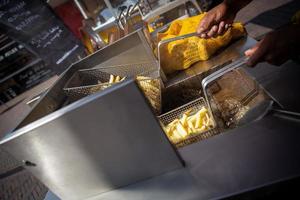 Frying fresh cut fries photo