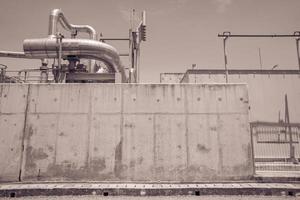 combine cycle project power plant when day time with sky and cloudy vibes.  The photo is suitable to use for industry background photography, power plant poster and electricity content media.