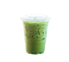 Iced matcha latte or Thai condensed milk-added green tea in transparent plastic glass isolated on white background photo