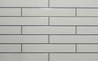 Small white tiled wall with beautiful horizontal pattern used for background or texture in decorative art work or template photo
