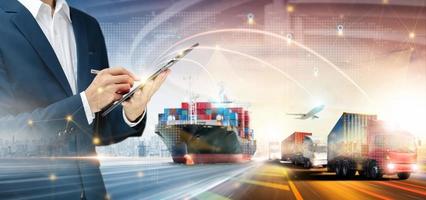 Global business network distribution of container cargo freight ship, plane, Truck and Businessman using tablet to delivery, Smart technology concept, Logistics import export transportation background photo