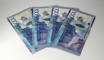 Paper banknotes of 1000 tenge of the national currency of the Republic of Kazakhstan on a white background photo