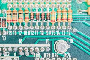 Condensers and Resistor assembly on the circuit board photo