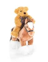 Teddy bear riding a horse photo