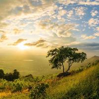 Mountain landscape with colorful vivid sunset on the cloudy sk photo