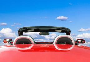 Red car with blue sky background photo