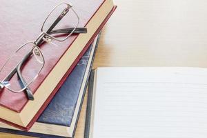 Eyeglasses and Notebook open blank page photo