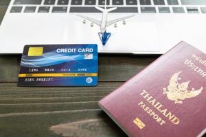 Passport with  credit card on laptop photo
