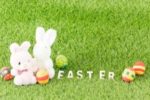 Bunny toy and Easter eggs with text photo