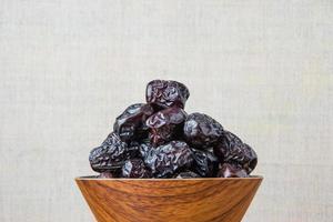 Delicious ajwa dates kurma nabi, Much sought after during the month of Ramadan as a dish for breaking the fast, ramadhan kareem, empty space, copy space. photo