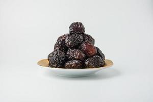 Delicious ajwa dates kurma nabi, Much sought after during the month of Ramadan as a dish for breaking the fast, ramadhan kareem, empty space, copy space. photo