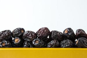Delicious ajwa dates kurma nabi, Much sought after during the month of Ramadan as a dish for breaking the fast, ramadhan kareem, empty space, copy space. photo