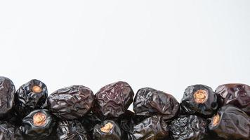 Delicious ajwa dates kurma nabi, Much sought after during the month of Ramadan as a dish for breaking the fast, ramadhan kareem, empty space, copy space. photo