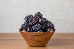 Delicious ajwa dates kurma nabi, Much sought after during the month of Ramadan as a dish for breaking the fast, ramadhan kareem, empty space, copy space. photo