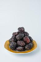 Delicious ajwa dates kurma nabi, Much sought after during the month of Ramadan as a dish for breaking the fast, ramadhan kareem, empty space, copy space. photo