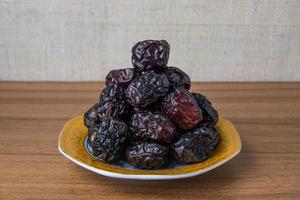 Delicious ajwa dates kurma nabi, Much sought after during the month of Ramadan as a dish for breaking the fast, ramadhan kareem, empty space, copy space. photo