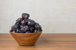 Delicious ajwa dates kurma nabi, Much sought after during the month of Ramadan as a dish for breaking the fast, ramadhan kareem, empty space, copy space. photo