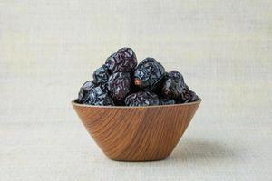 Delicious ajwa dates kurma nabi, Much sought after during the month of Ramadan as a dish for breaking the fast, ramadhan kareem, empty space, copy space. photo