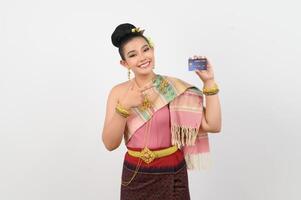 Young beautiful woman in northeastern dress show credit card posture photo