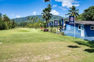 Mahe Seychelles 05.03.2023 the 9 holes golf court on Mahe island Seychelles, Seychelles bear seybrew marketing board on the side photo