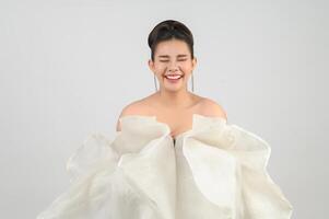 Young asian beautiful bride smiling with happy on white background photo