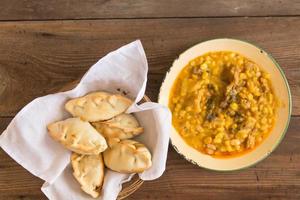 locro dishes and empanadas, traditional Argentine foods that are frequently consumed for national holidays, such as the revolution of May 25 and independence on July 9 photo