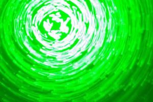 abstract background of green light circles made with lightpainting technique photo