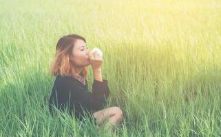 woman happily drinking coffee photo