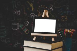 black photo frame on the stand on the books in classroom