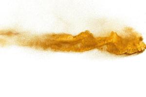 Brown sand explosion isolated on white background. Abstract sand cloud backdrop. photo