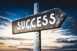 Success - Wooden Signpost with one Arrow, Sunset Sky in Background photo