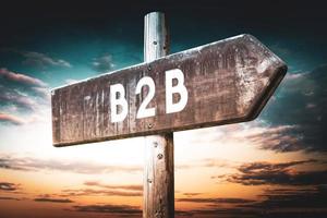 B2B - Business To Business - Wooden Signpost with one Arrow, Sunset Sky in Background photo