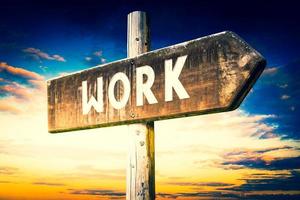 Work - Wooden Signpost with one Arrow, Sunset Sky in Background photo