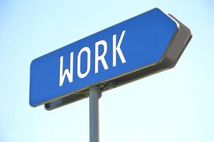 Work - Blue Metal Signpost and Sky in Background photo