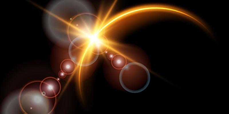 The edge of a golden solar eclipse on a black background. Golden eclipse for product advertising, natural phenomena, horror concept and others.