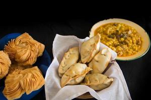 dishes of locro empanadas and sweet pastries, traditional Argentine foods that are frequently consumed for national holidays, such as the revolution of May 25 and independence on July 9 photo