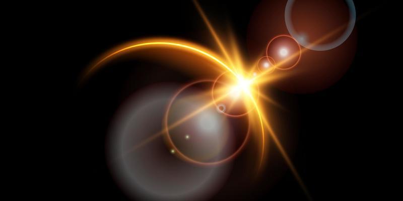 The edge of a golden solar eclipse on a black background. Golden eclipse for product advertising, natural phenomena, horror concept and others.