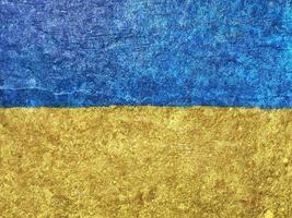 Ukrainian flag painted on wall background photo