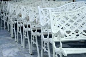 Close up White Wrought Benches. photo