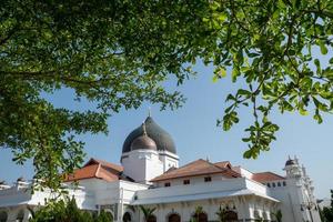 Kapitan Keling Mosque with foreground leaves photo