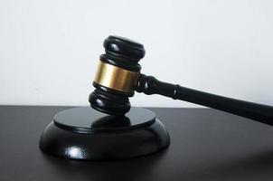 Lawyer gavel on wooden table with white background. photo