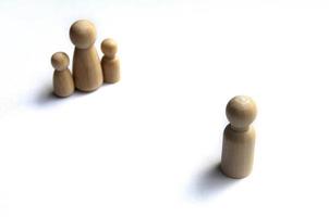 Wooden dolls representing family on white background. Copy space and family photo